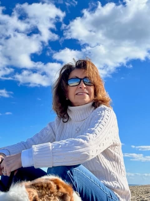 Karen Shehade at the beach on a clear fall day